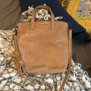 Able crossbody in a light tan. Very good condition and clean!